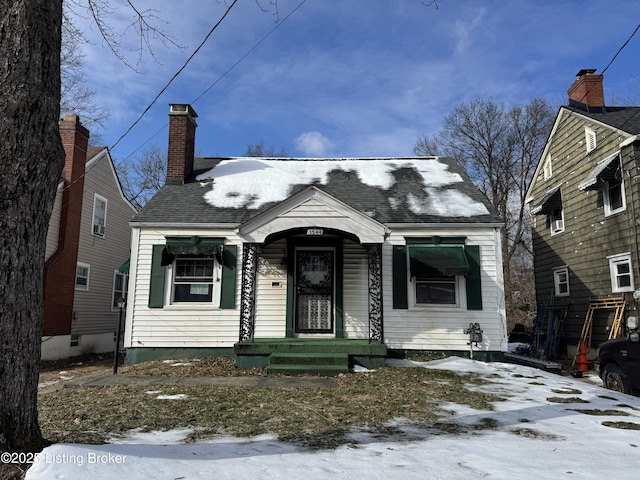 bungalow-style house with a chimney