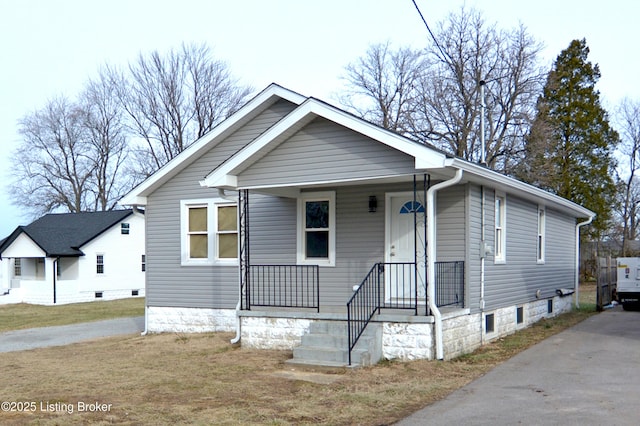 bungalow-style house with a front yard