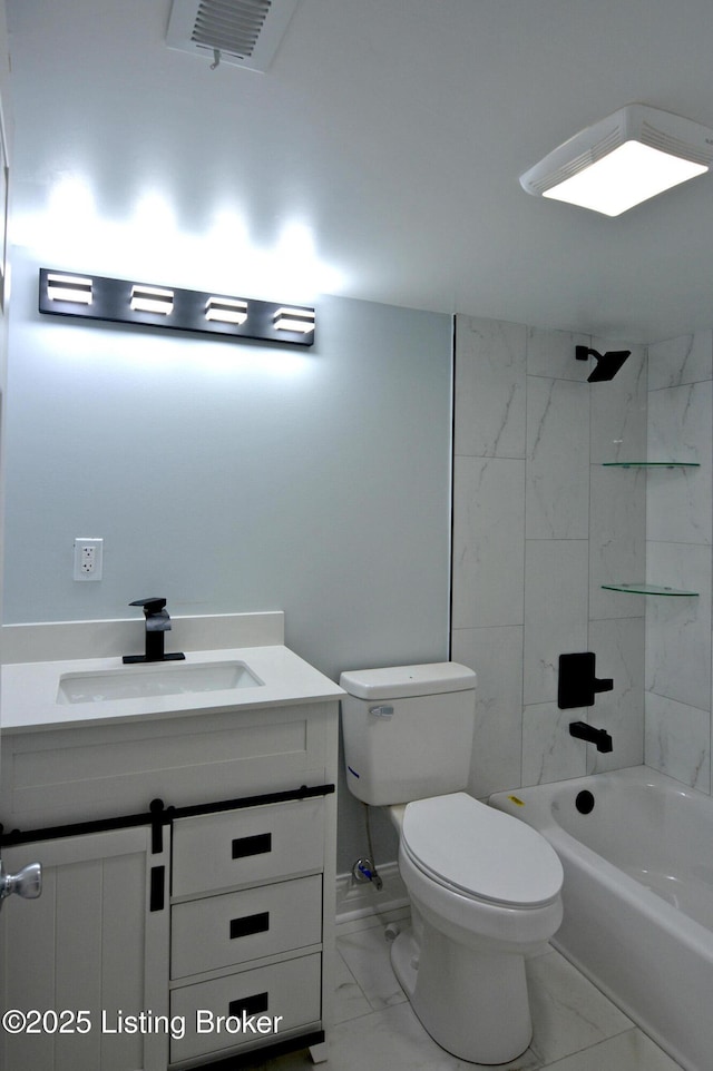 full bathroom with vanity, toilet, and tiled shower / bath