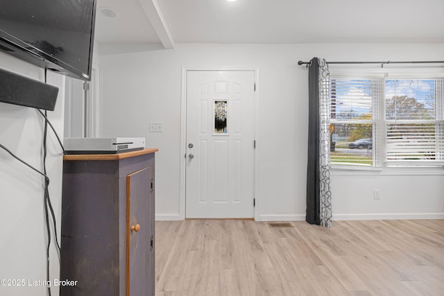 entrance foyer with light hardwood / wood-style flooring