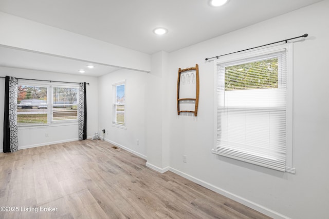 spare room with light hardwood / wood-style floors