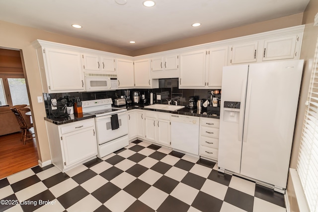 kitchen featuring tile countertops, white cabinetry, sink, decorative backsplash, and white appliances