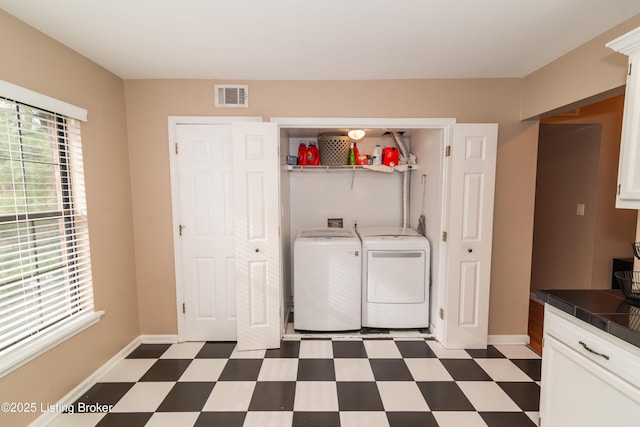 laundry room with independent washer and dryer