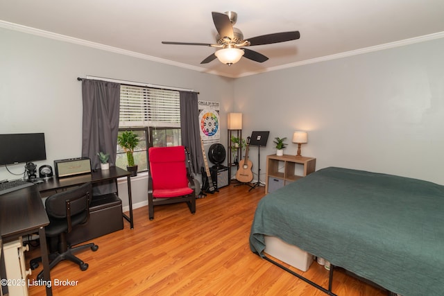 bedroom featuring ornamental molding, light hardwood / wood-style floors, and ceiling fan