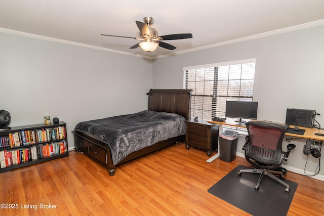 bedroom featuring ornamental molding, ceiling fan, and light wood-type flooring