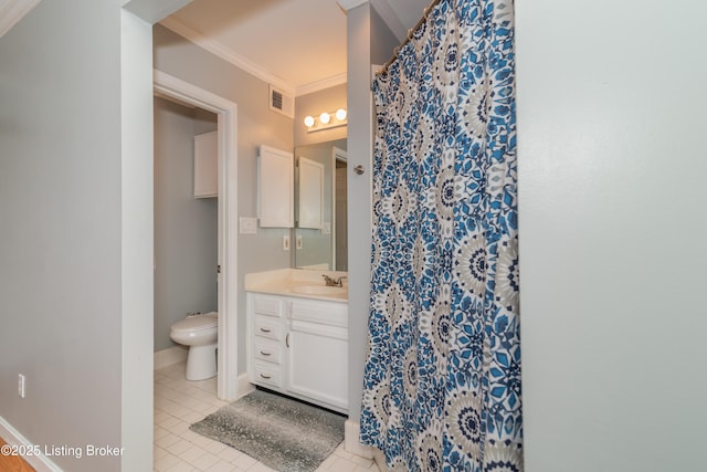 bathroom with vanity, tile patterned floors, crown molding, and toilet