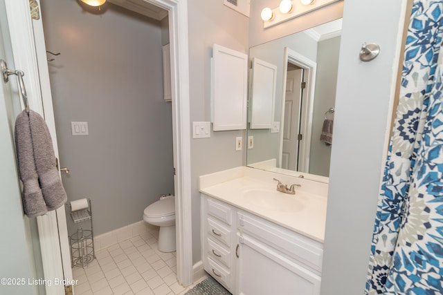 bathroom with tile patterned flooring, vanity, ornamental molding, and toilet