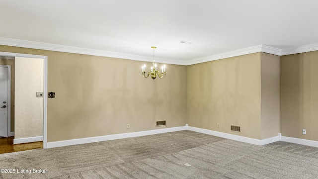 unfurnished room featuring crown molding, a chandelier, and carpet