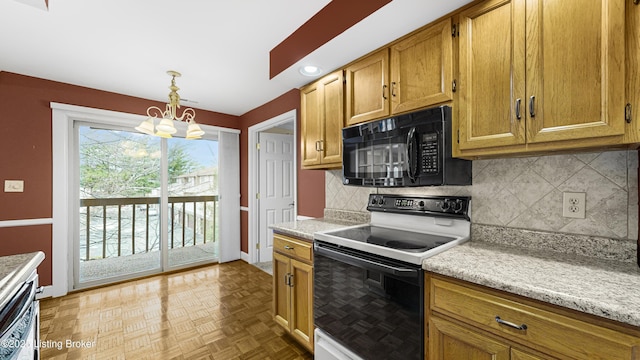 kitchen with pendant lighting, backsplash, light parquet floors, electric range, and light stone countertops