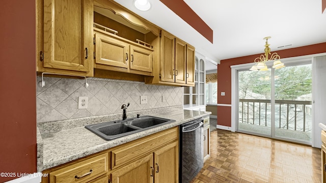 kitchen with dishwasher, sink, decorative backsplash, hanging light fixtures, and light stone counters