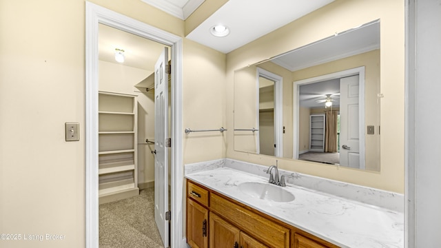 bathroom with ornamental molding and vanity