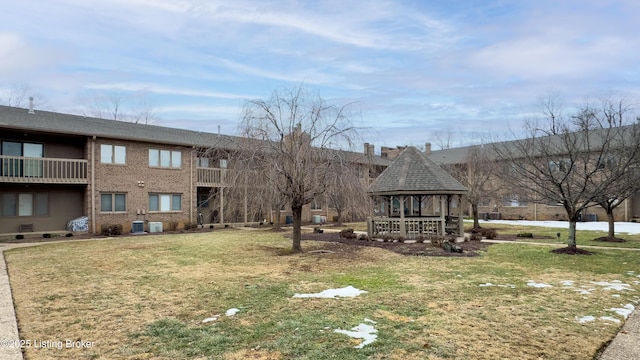 view of property's community featuring a yard and a gazebo