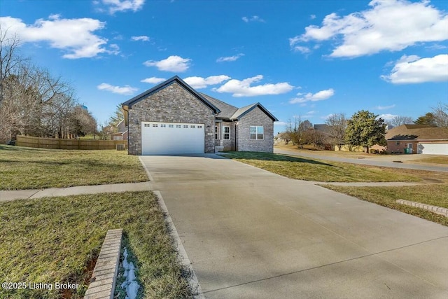 view of front of property featuring a garage and a front lawn