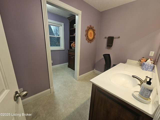 bathroom featuring vanity and a textured ceiling