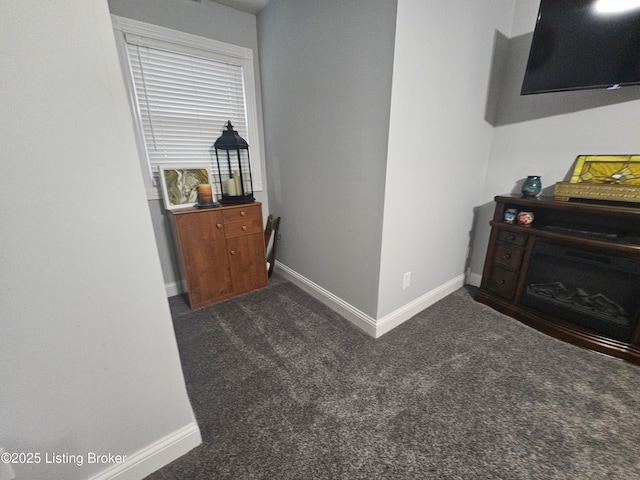 living room featuring dark carpet