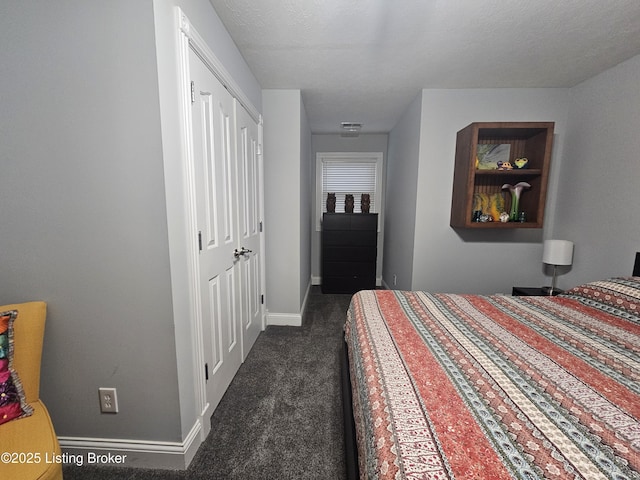 bedroom with dark colored carpet