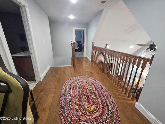 hall with hardwood / wood-style floors