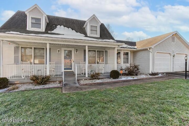 new england style home featuring a garage, a porch, and a front lawn