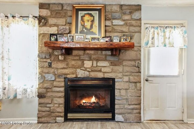 interior details with hardwood / wood-style flooring and a fireplace