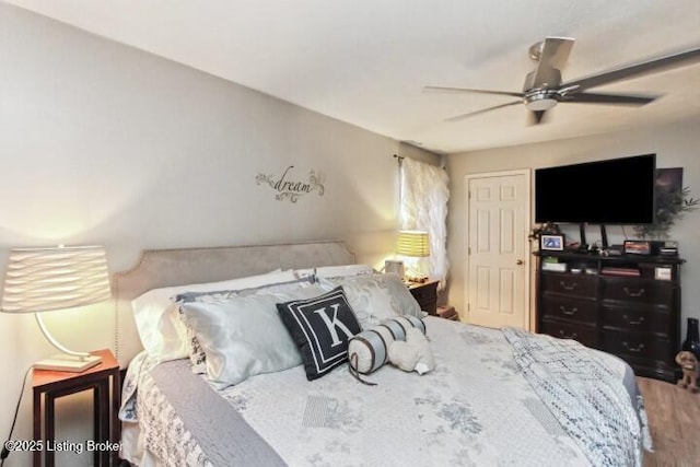 bedroom featuring hardwood / wood-style floors and ceiling fan