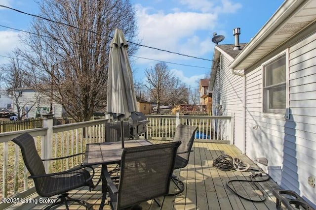 wooden deck featuring area for grilling