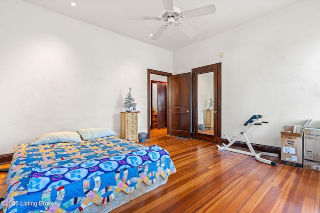 bedroom featuring hardwood / wood-style floors and ceiling fan