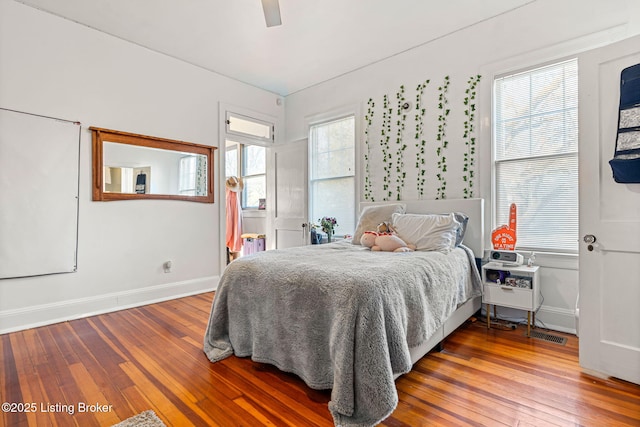 bedroom with hardwood / wood-style flooring and ceiling fan