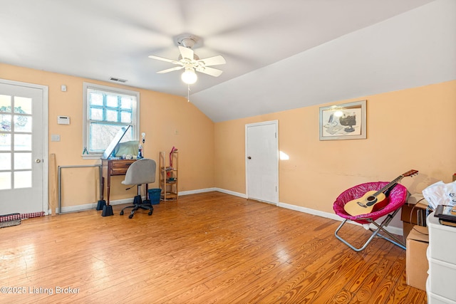 office space with ceiling fan, lofted ceiling, and light wood-type flooring