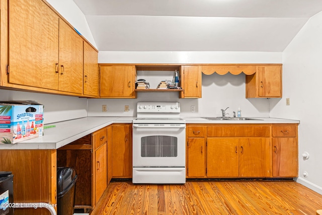 kitchen featuring sink, white electric range oven, and light hardwood / wood-style flooring