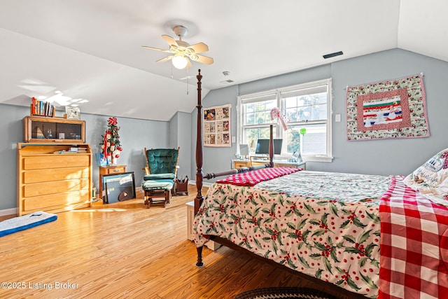 bedroom featuring wood-type flooring, vaulted ceiling, and ceiling fan