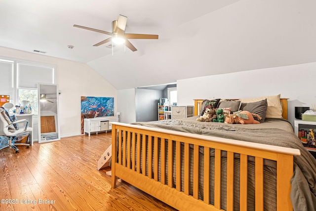 bedroom featuring lofted ceiling, hardwood / wood-style floors, and ceiling fan