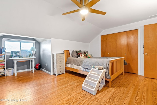 bedroom featuring lofted ceiling, ceiling fan, and light hardwood / wood-style flooring