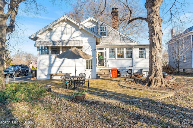 rear view of house with a patio