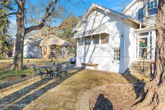 back of property featuring a patio area