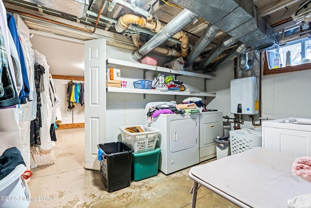 basement featuring independent washer and dryer and water heater