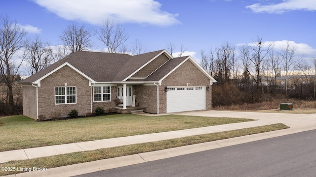 view of front of property featuring a garage and a front yard