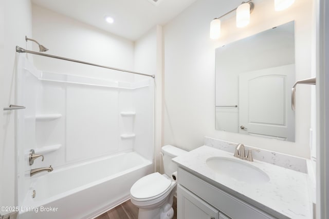 full bathroom with toilet, vanity,  shower combination, and wood finished floors