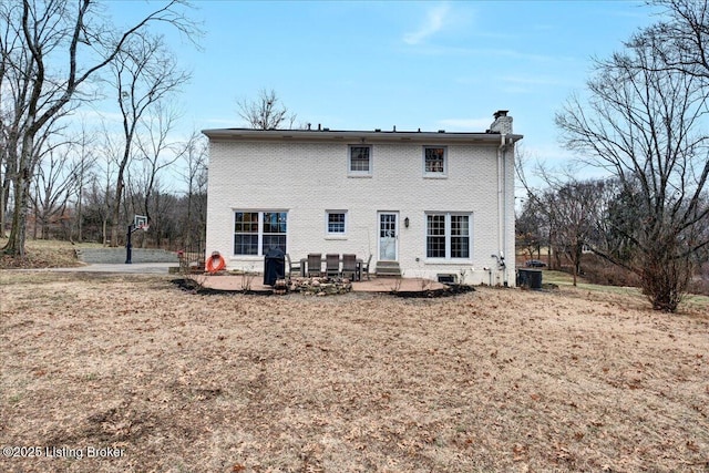 back of property featuring a yard, a patio, and central air condition unit