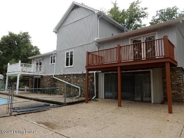 rear view of property featuring a patio area