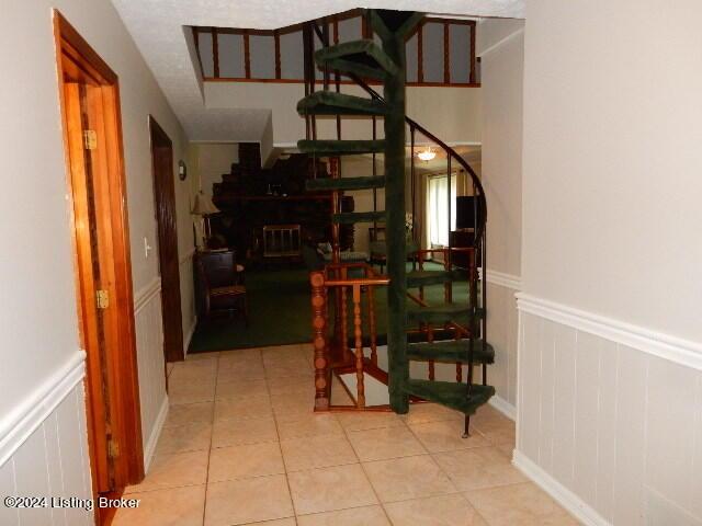 stairway featuring tile patterned floors