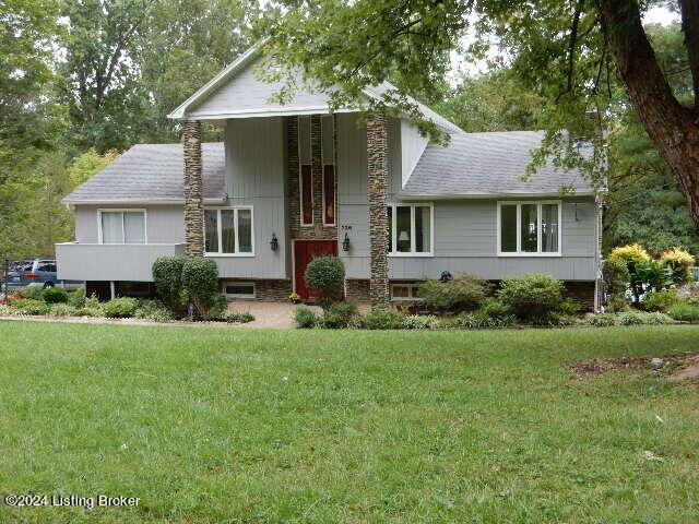 view of front of home with a front yard