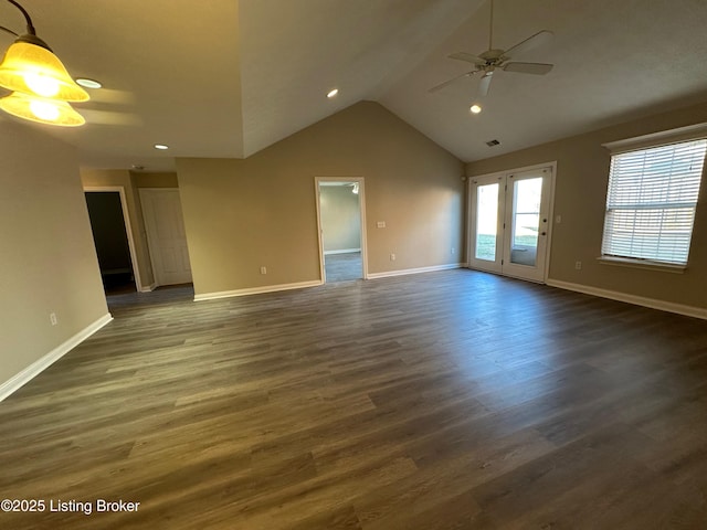 unfurnished room featuring lofted ceiling, dark wood-type flooring, and ceiling fan