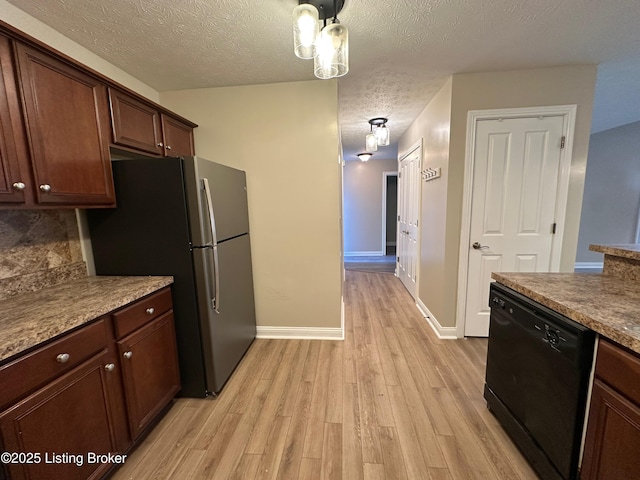 kitchen featuring light hardwood / wood-style flooring, stainless steel refrigerator, dishwasher, dark brown cabinetry, and decorative backsplash