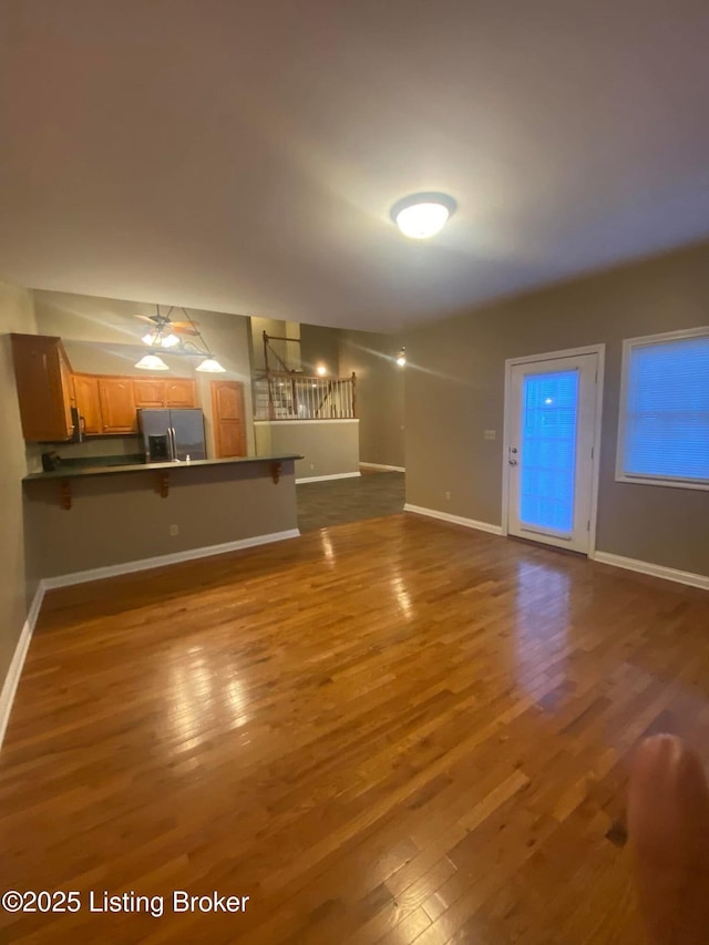 unfurnished living room with hardwood / wood-style floors