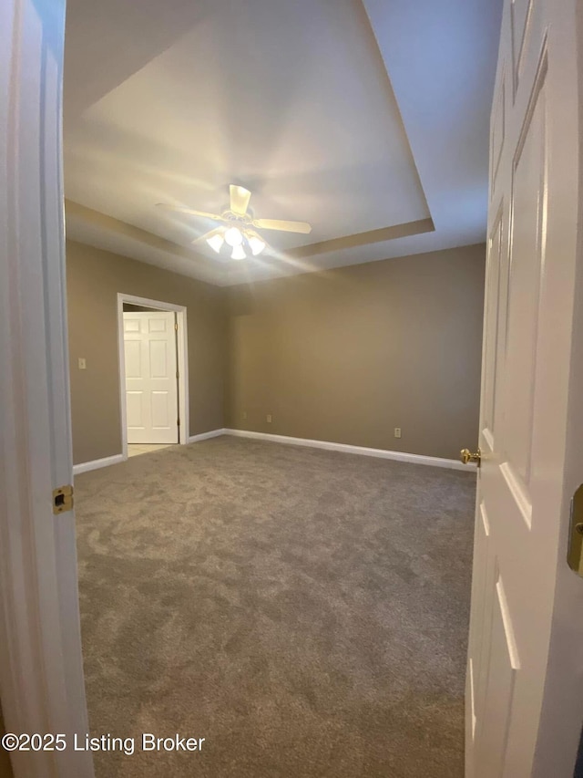 carpeted empty room with ceiling fan