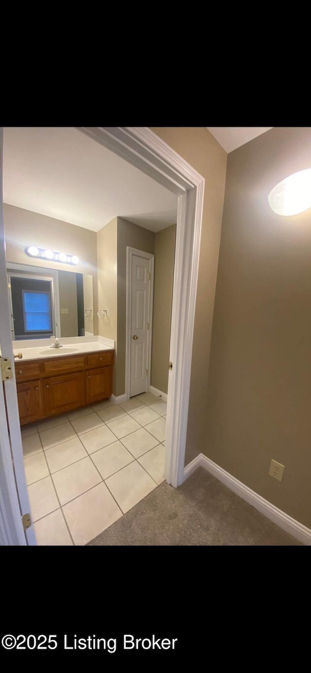 bathroom featuring vanity and tile patterned flooring