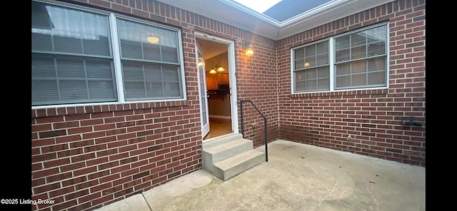 doorway to property with a patio area