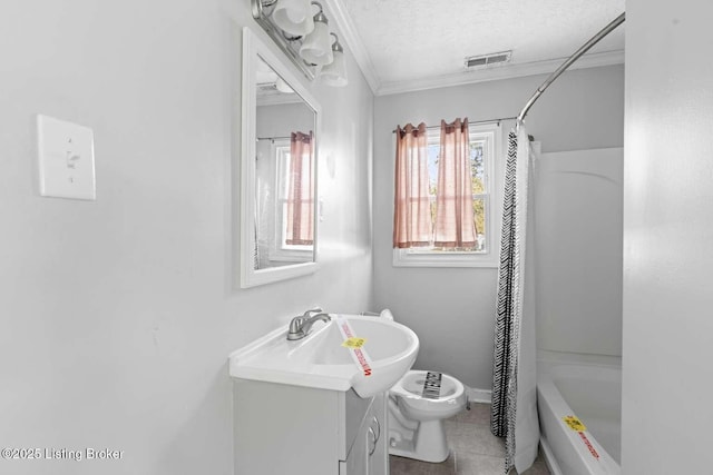 full bathroom featuring shower / tub combo with curtain, toilet, crown molding, a textured ceiling, and vanity