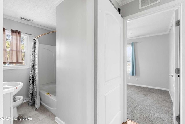 bathroom featuring shower / bathtub combination with curtain, crown molding, tile patterned flooring, a textured ceiling, and toilet