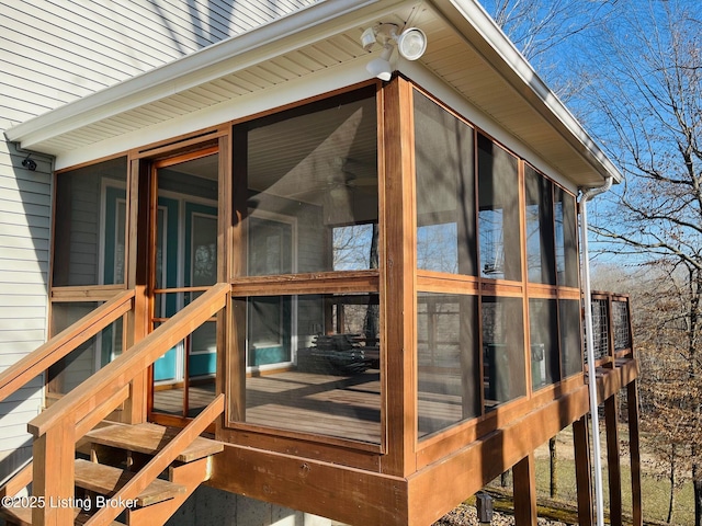 wooden deck featuring a sunroom